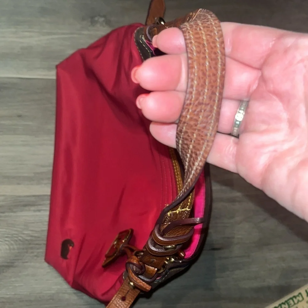Dooney & Bourke boho sak purse in red with hot pink interior 1975 tag